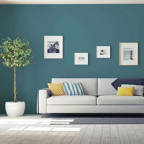 This darker sage green paint with warm teal undertones will bring luxury and spa-like vibes to any interior walls, particularly when paired with white furniture and dark wood accents.